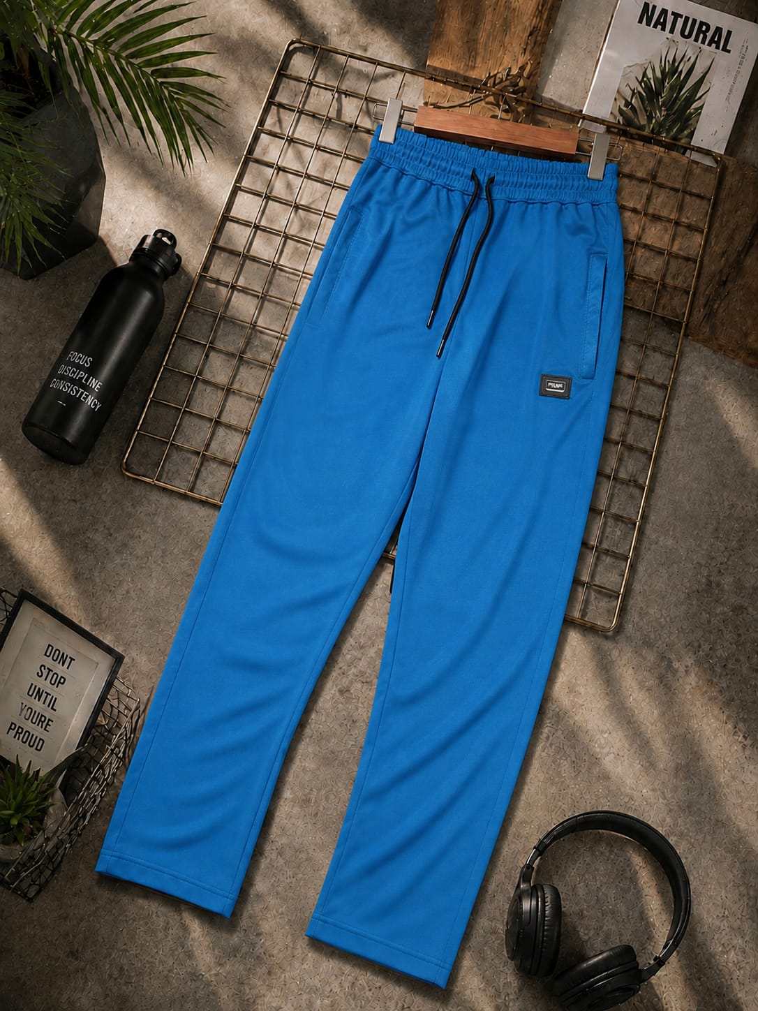 Men’s blue jogger trousers with elastic waistband, drawstring and side pockets