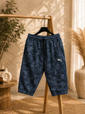 Dark navy blue printed men’s shorts with a comfortable elastic waistband, adjustable drawstring, side pockets, and relaxed fit, displayed on a wooden clothing rack.